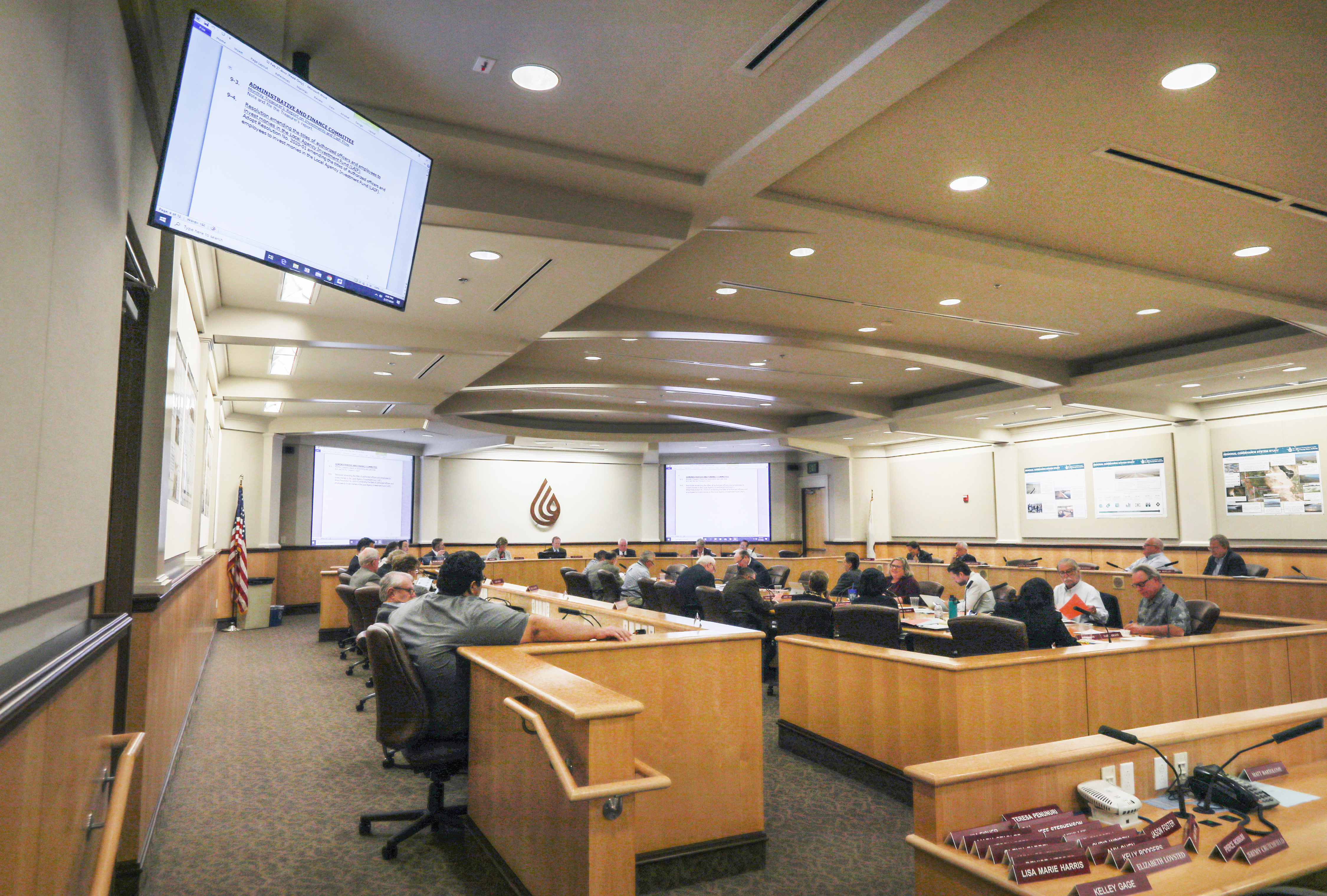 Construction workers gathering to commemorate the desalination of water via the Carlsbad plant.